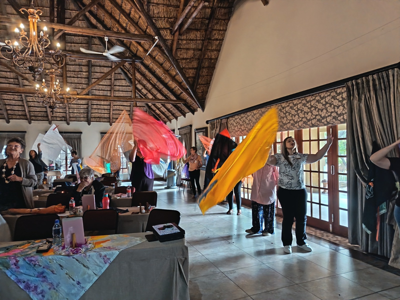 Women waving worship flags in the hall