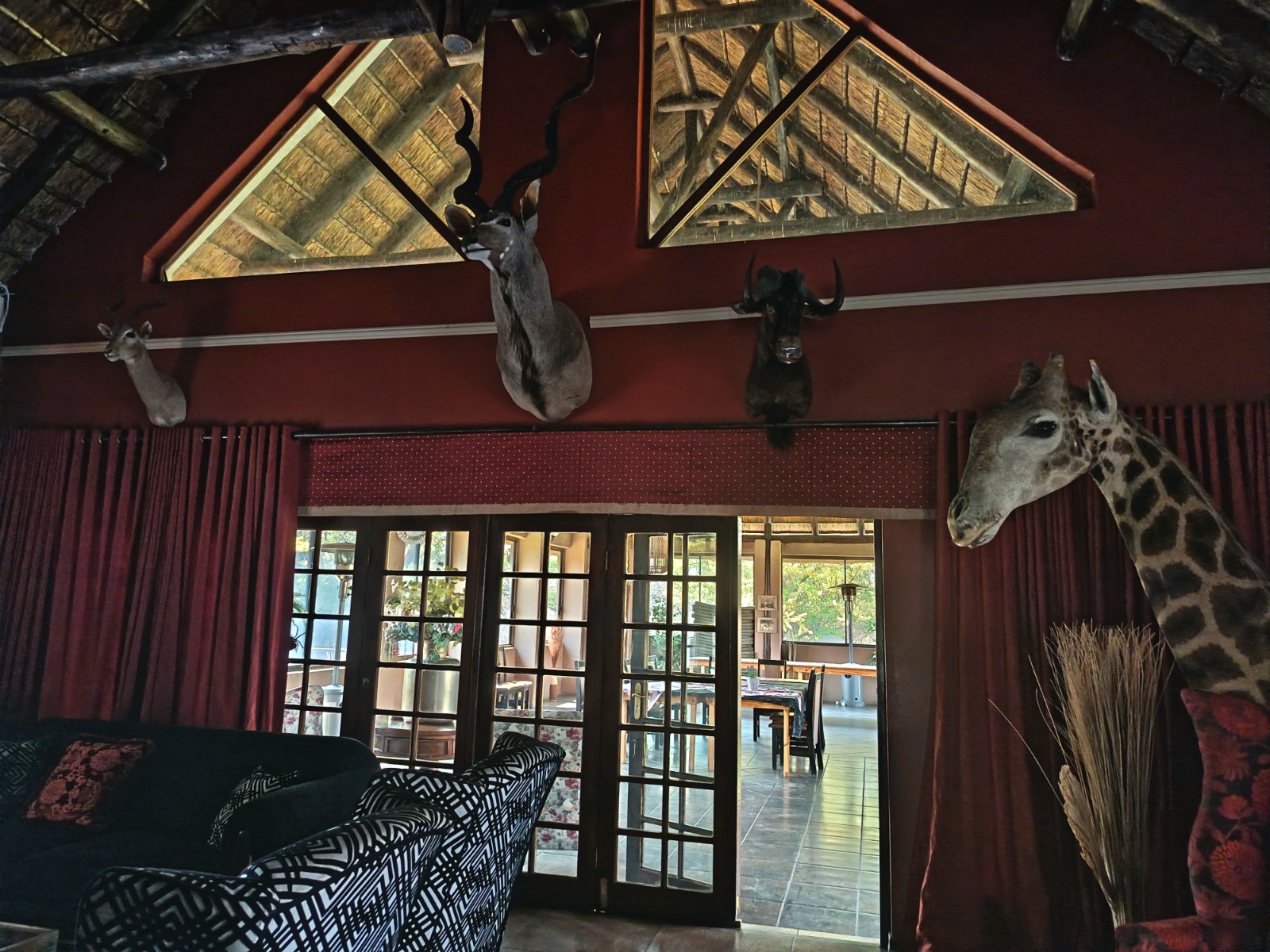 Warm lodge lounge with thatched beams