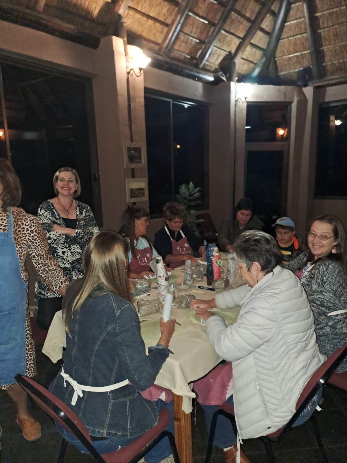 Women gathered around a craft workshop table