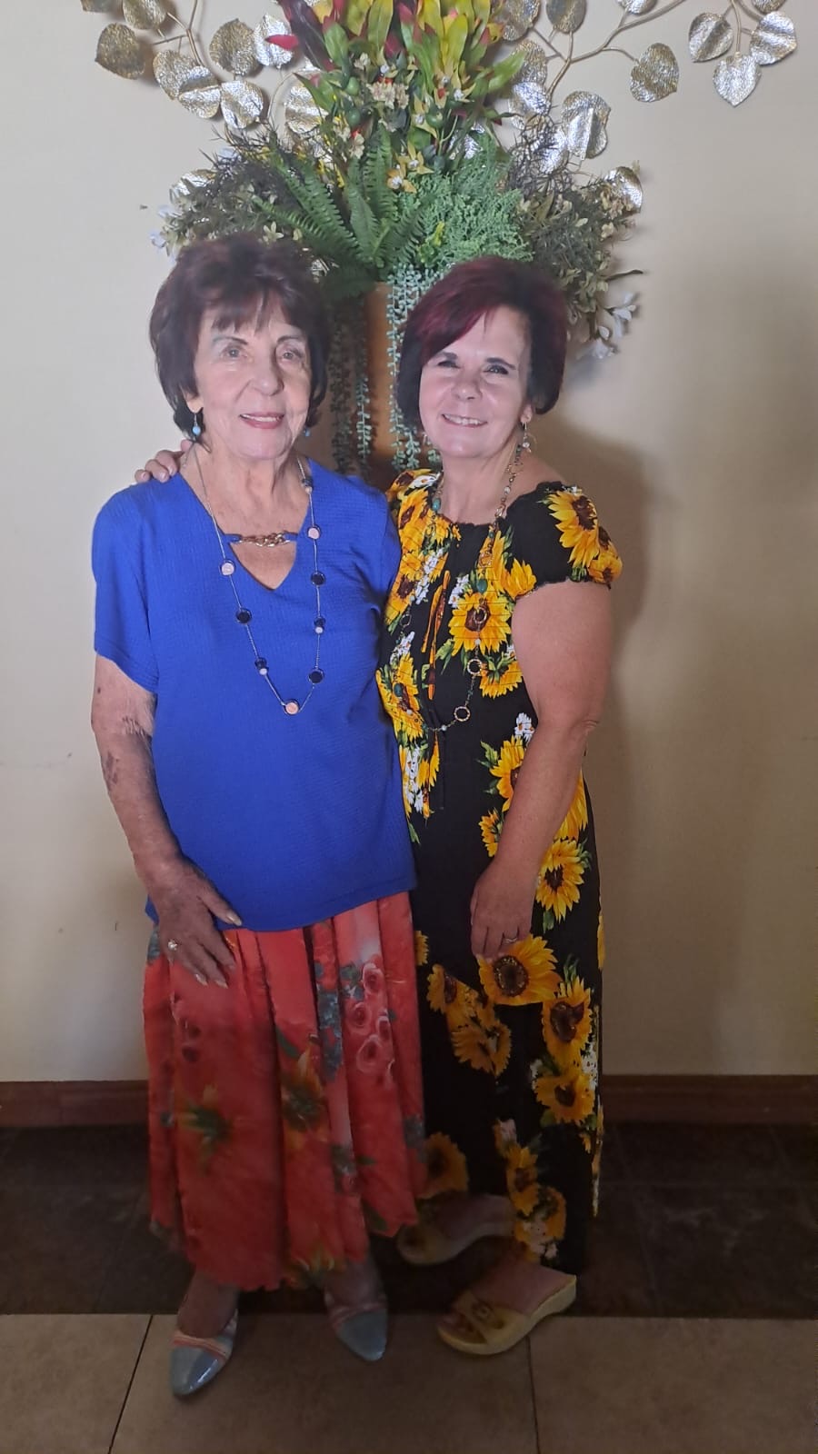 Sisters smiling side by side